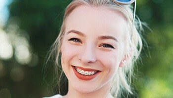 Young girl with traditional braces