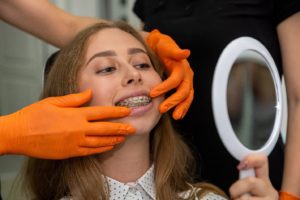 Young woman at appointment to repair broken braces