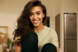 Smiling woman enjoying the health benefits of straight teeth